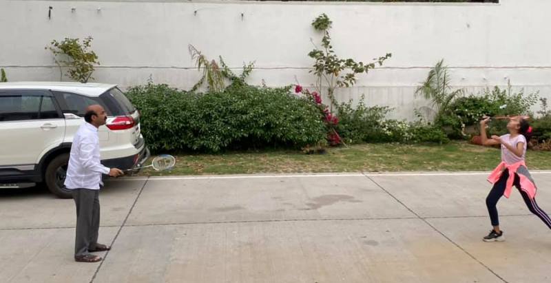Harish Dwivedi playing Badminton with his daughter