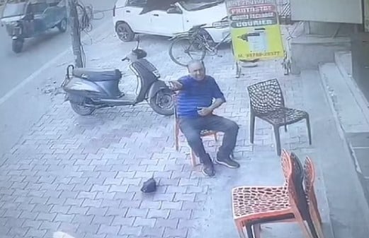 Harjinder Singh alias Mela sitting on a chair after being shot