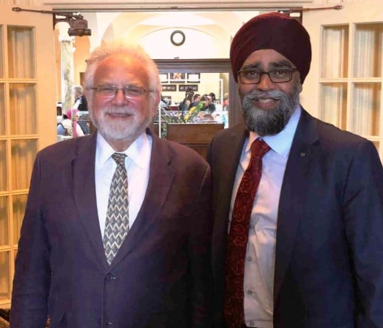 Harjit Sajjan posing with Barnett Rubin