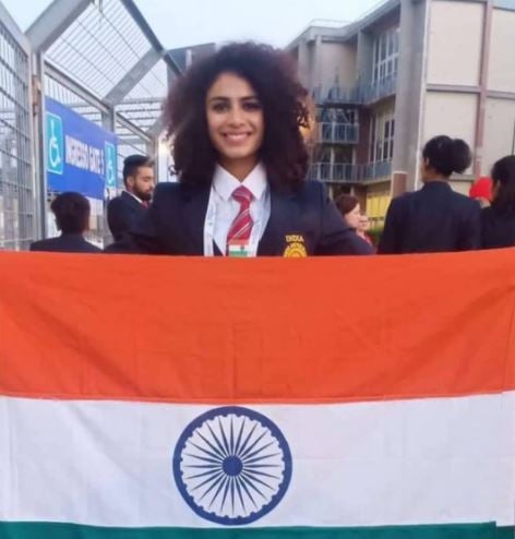 Harmilan with the flag at the World University Games 2019 at Napoli in Italy