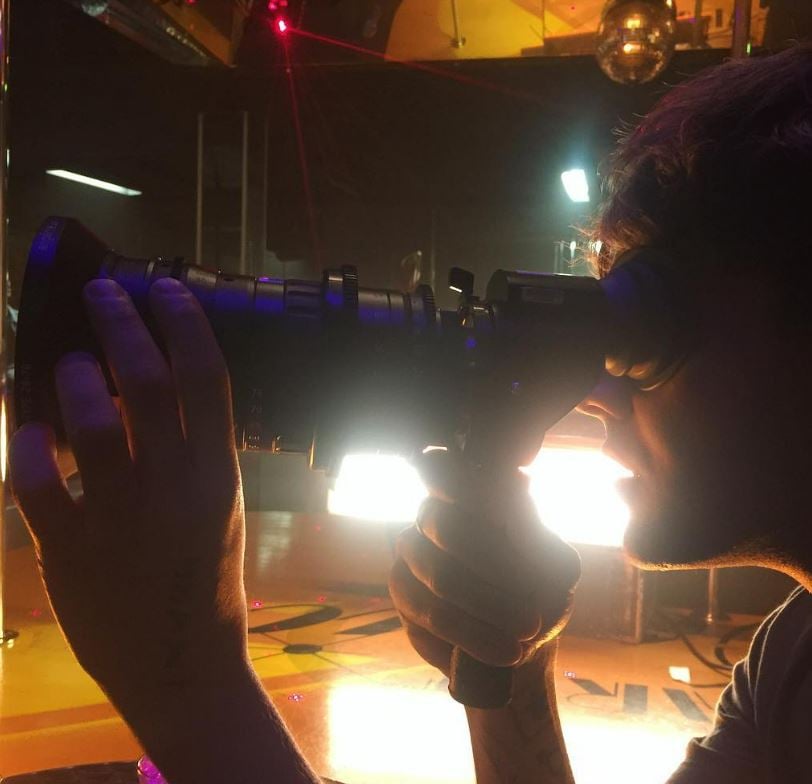 Harris Dickinson doing photography