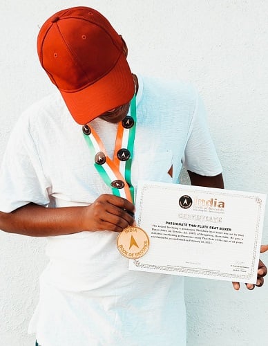 Harry d Cruz holding India Book of Records certificate