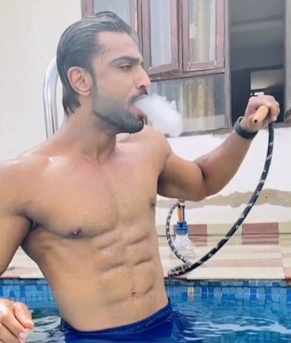 Harsh Arora while smoking a Hookah