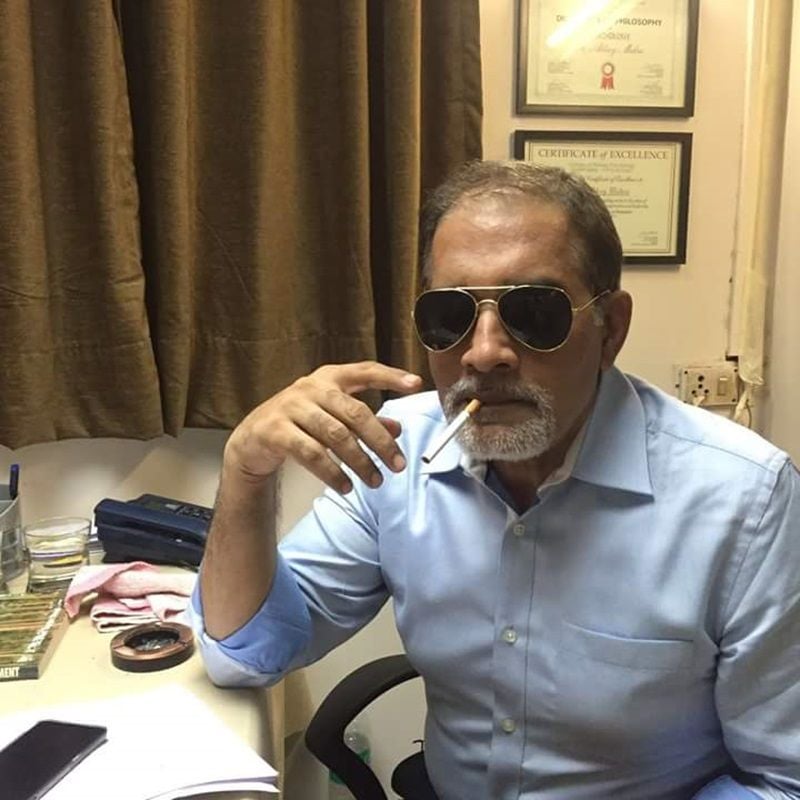 Haresh Khatri holding a cigarette