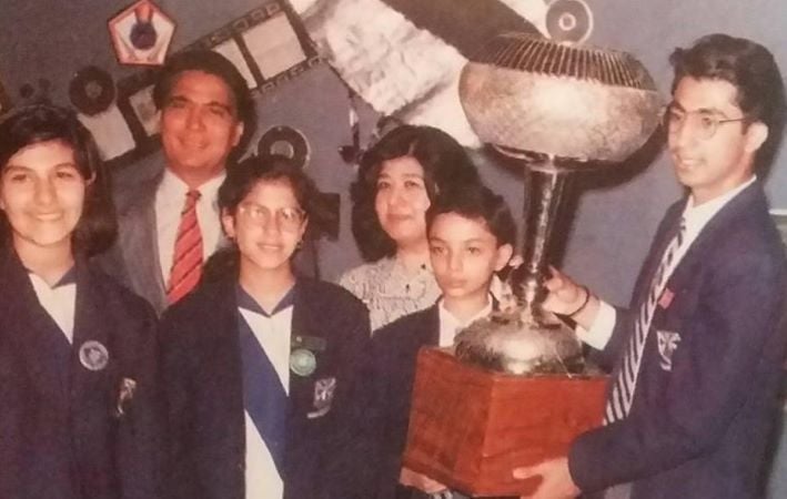 Hassan Sheheryar Yasin holding the trophy won in a debating competition