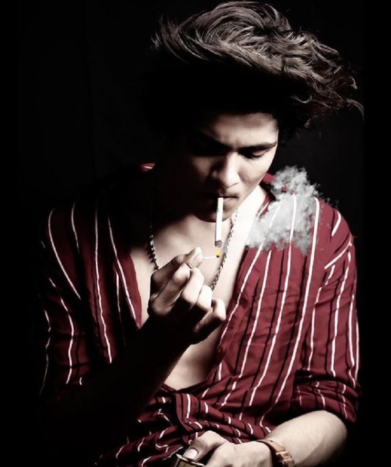 Hassan Siddiquee smoking a cigarette