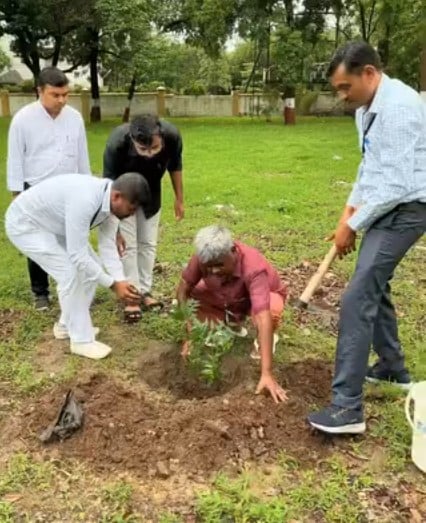 Heera Lal Patel while planting a sapling