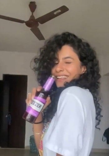 Himika Bose drinking beer