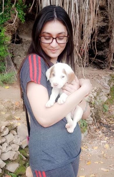 Hina Chaudhary with a puppy
