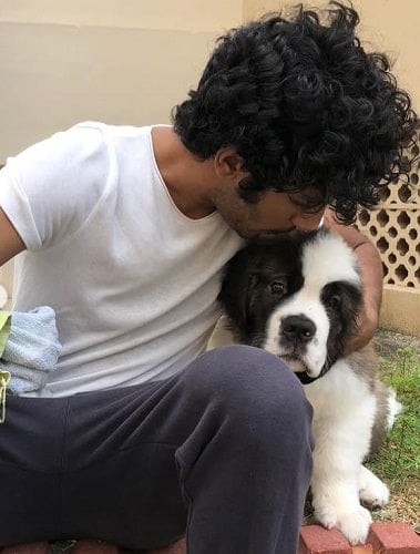 Hridhu Haroon with his pet dog