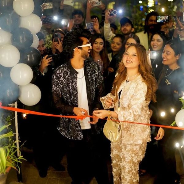 Hussain Tareen cutting ribbon along with his fiancé during the launch of his brand