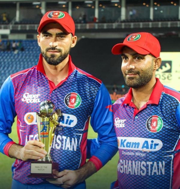 Ibrahim Zadran with Hashmatullah Shahidi (right) after winning a T20I match