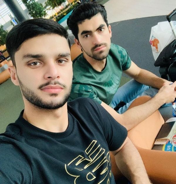 Ibrahim Zadran with Naveen-ul-Haq (left) during his playing days in England