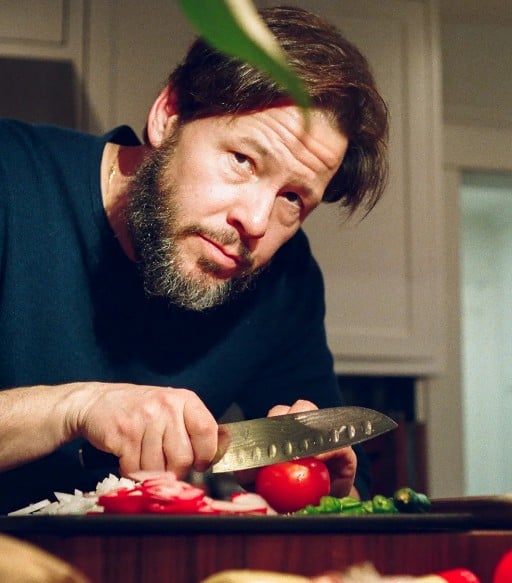 Ike Barinholtz while cooking food