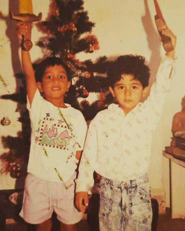 Imaad Shah (right) in childhood