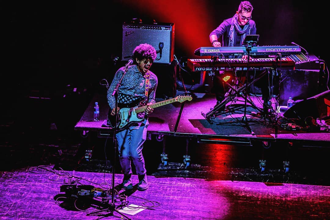 Imaad Shah while playing the guitar