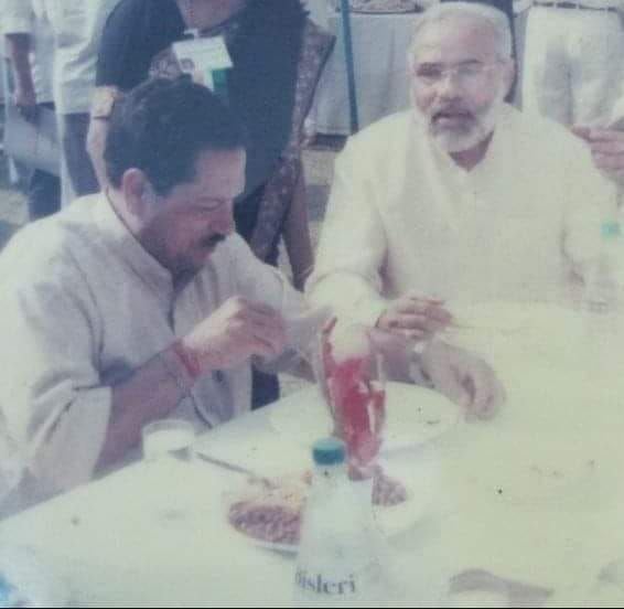 Indresh Kumar with Narendra Modi (right)
