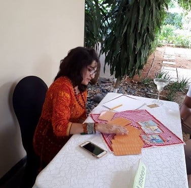 Inseeya Khambati while reading tarot cards