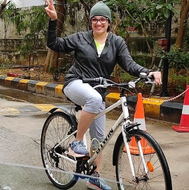 Inseeya Khambati while riding a bicycle