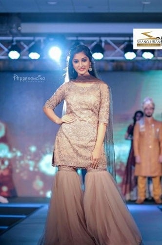 Isha Sharma walking the ramp in a fashion show