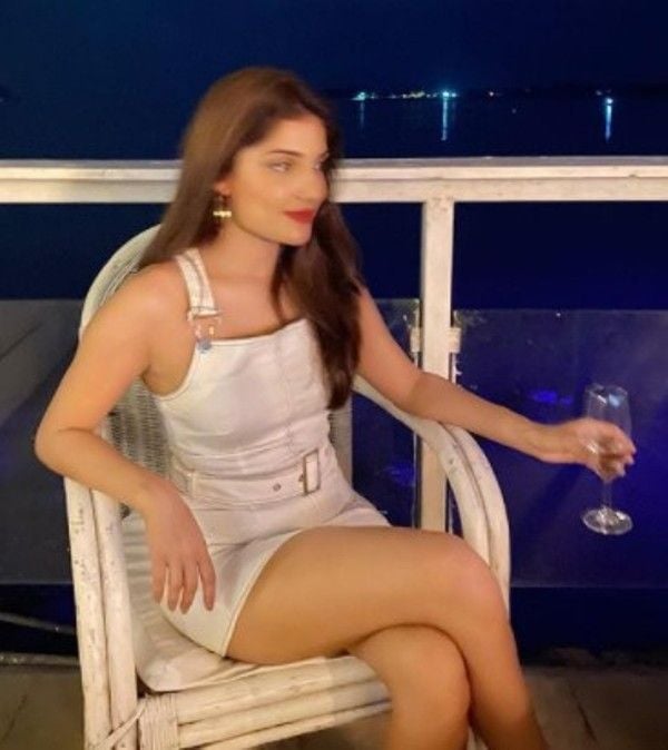 Ishita holding a glass of wine