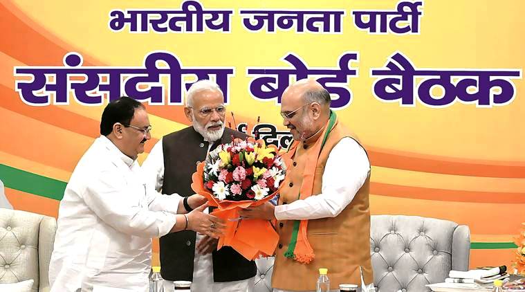 JP Nadda with Amit Shah (right) and Narendra Modi (center) after being named as BJP National President