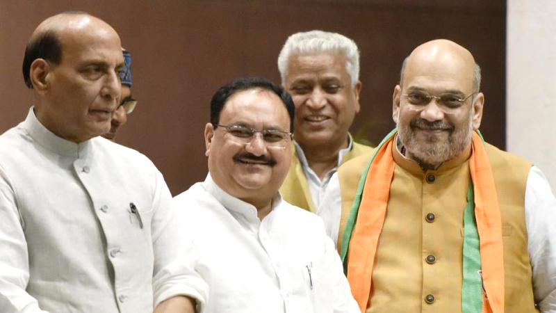 JP Nadda with Amit Shah (right) and Rajnath Singh (left) at the BJP central headquarters