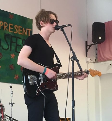 Jack Kilmer playing guitar