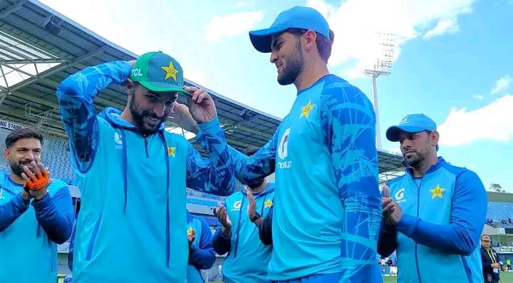 Jahandad Khan receiving his T20I cap from Shaheen Afridi
