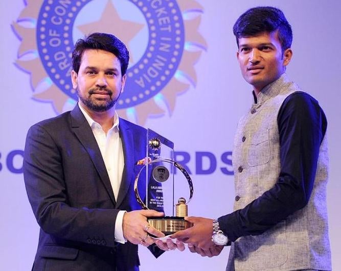Jalaj Saxena receiving BCCI