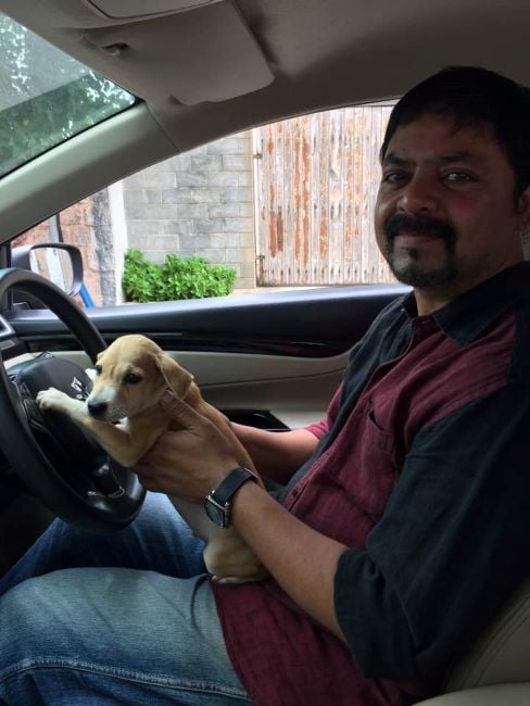 James Vasanthan with a street puppy