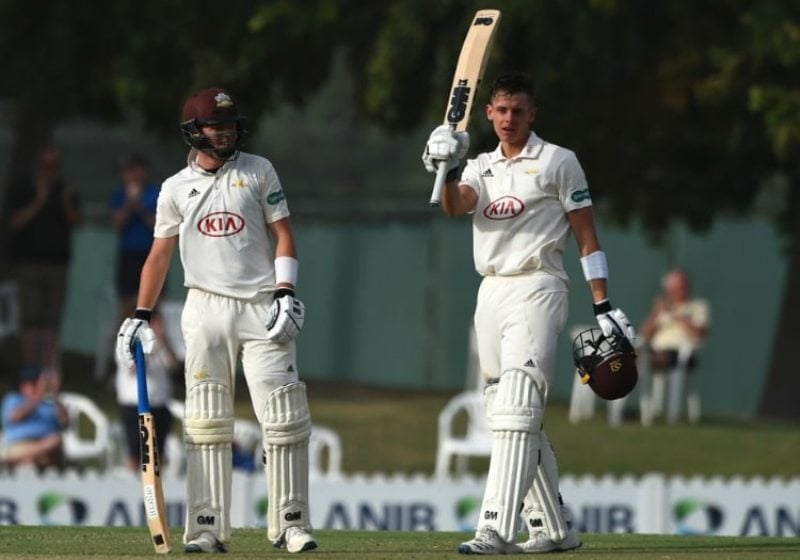 Jamie Smith celebrating after scoring a century against MCC in Dubai