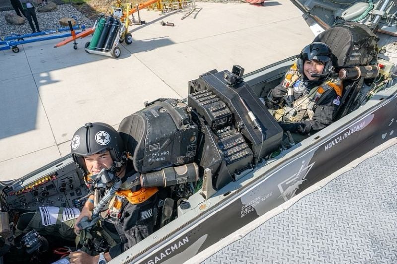 Jared Isaacman sitting in the cockpit of a Russian-built MiG fighter aircraft