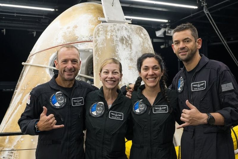 Jared Isaacman standing with the crew of Polaris Dawn