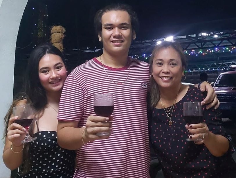 Jas Dudley-Scales holding a glass of wine