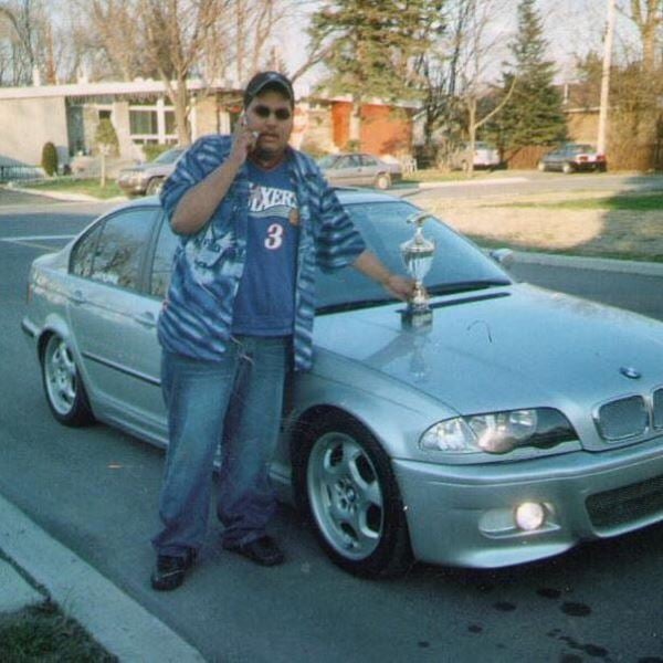 Jas Mathur at the age of 16 posing with his first car