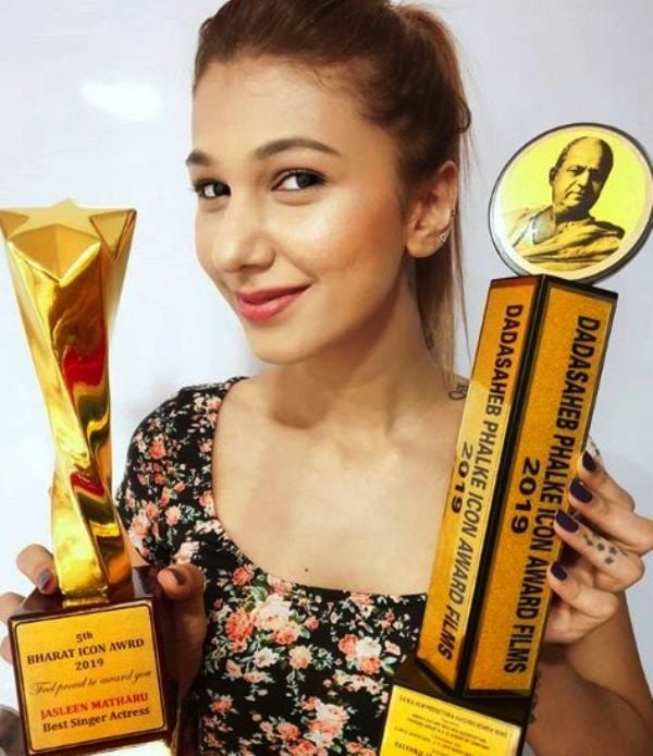 Jasleen Matharu Posing With Her Awards