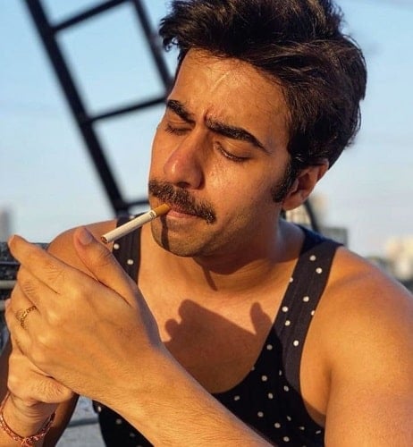 Jatin Arora smoking a cigarette