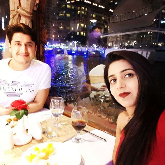 Jatin Suri with a glass of alcohol