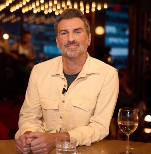 Jean-Thomas Jobin drinking wine at a restaurant in Quebec, Canada