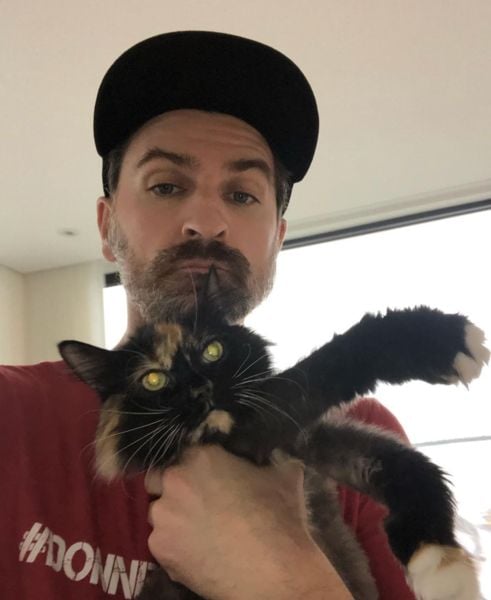 Jean-Thomas Jobin with his pet cat Bubble