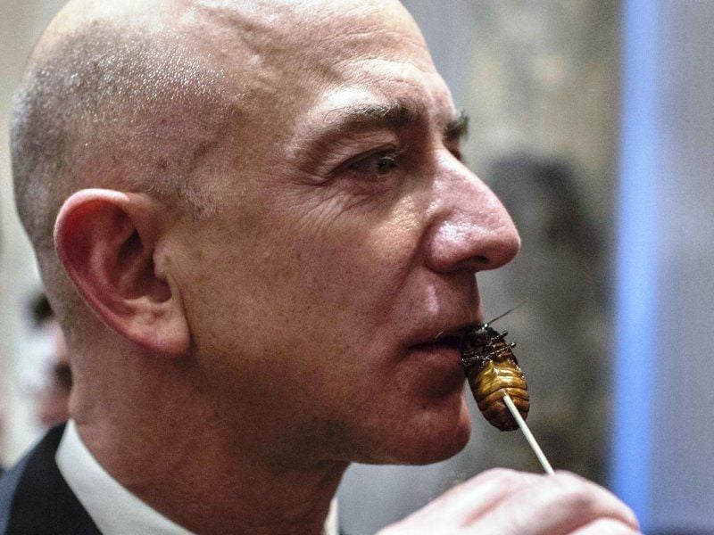 Jeff Bezos eating a cooked cockroach