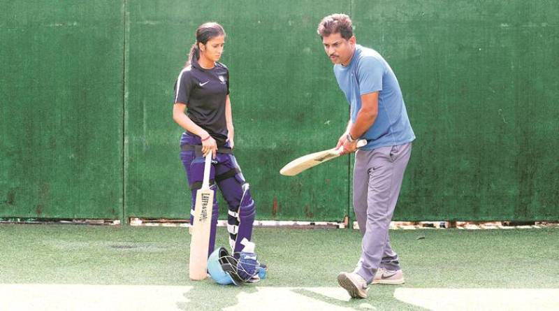 Jemimah practicing with her coach and father, Ivan Rodrigues