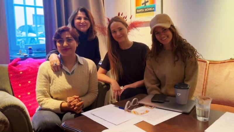 Jennifer Lawrence (second from the right) while working on the documentary 