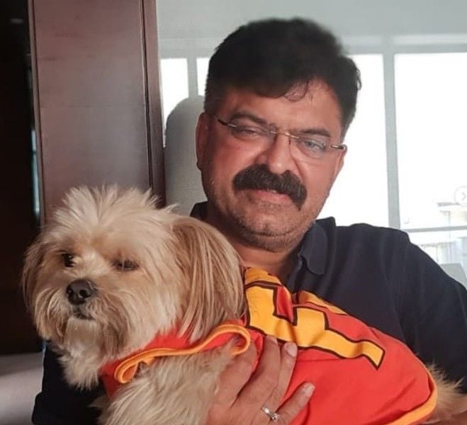Jitendra Awhad playng with his dog