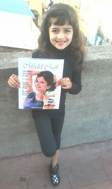 Jiya Amin holding the magazine 