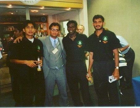 Jo (right most) holding a bottle of beer