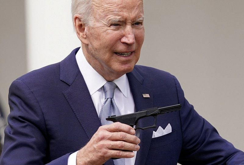 Joe holding the lower receiver of a disassembled pistol