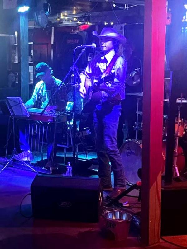 John Foster while performing live at an event