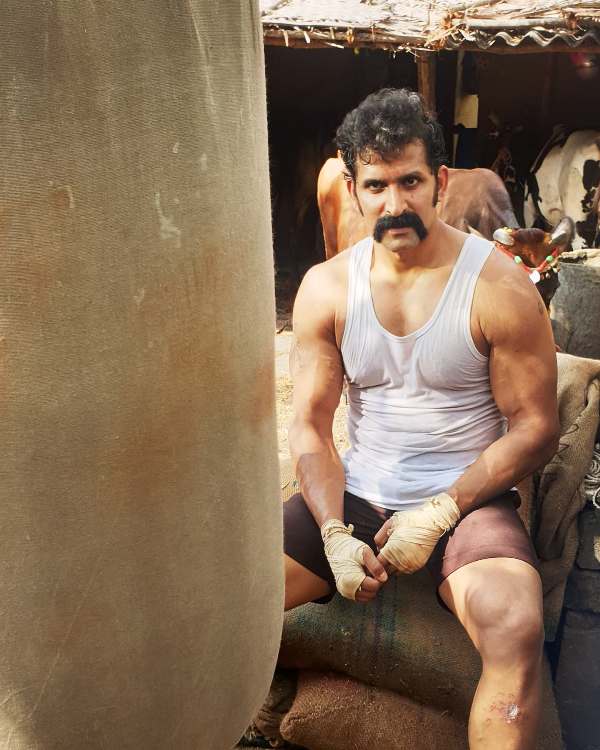 John Kokken as Vembuli, in the film Sarpatta Parambarai